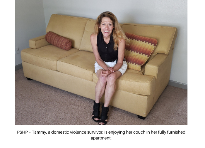 Tammy, a domestic violence survivor, is enjoying her couch in her fully furnished apartment.
